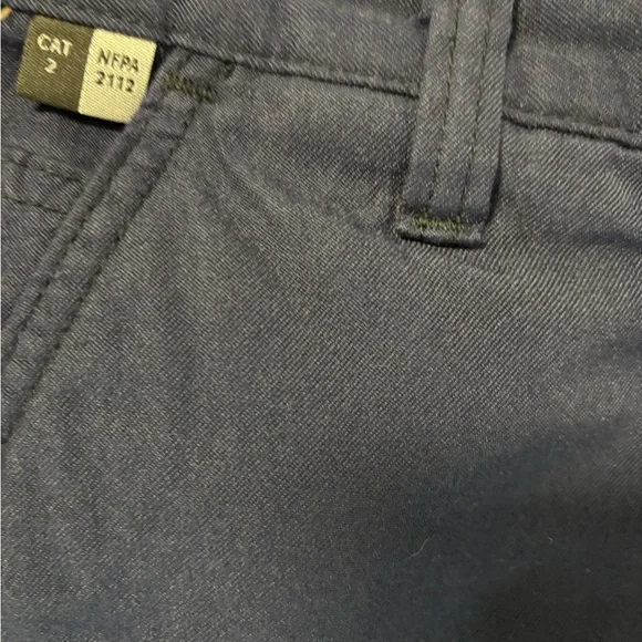 Durable Carhartt FR flame-resistant work pants in navy. Size 34x30.